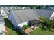 Birds eye view of backyard with established garden beds, lush lawn, and patio at 326 Slate Dr, Gibsonville, NC 27249