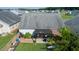 Aerial view of backyard with patio, pergola, garden beds, and green lawn at 326 Slate Dr, Gibsonville, NC 27249