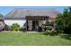 The backyard patio has a pergola, landscaping and room for entertaining at 326 Slate Dr, Gibsonville, NC 27249