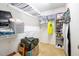 Spacious walk-in closet providing ample storage with shelves, hanging rods, and organizational containers at 326 Slate Dr, Gibsonville, NC 27249
