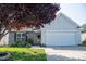 Charming single-story home with well-maintained lawn and an attached two-car garage at 326 Slate Dr, Gibsonville, NC 27249