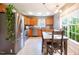 Eat-in kitchen with stainless steel appliances, wooden cabinets, and natural lighting at 326 Slate Dr, Gibsonville, NC 27249