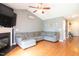 Bright living room featuring hardwood floors, a fireplace, and modern décor at 326 Slate Dr, Gibsonville, NC 27249