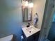 Bathroom with a new vanity, updated mirror, and a toilet at 331 E Lillington St, Angier, NC 27501