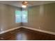 Bedroom with hardwood floors, natural light, and a ceiling fan at 331 E Lillington St, Angier, NC 27501