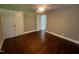 Spacious bedroom with hardwood floors, a ceiling fan, and a closet at 331 E Lillington St, Angier, NC 27501
