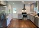 Spacious kitchen featuring granite countertops, stainless steel appliances and side-by-side washer/dryer unit at 331 E Lillington St, Angier, NC 27501