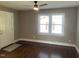 Bright living room features hardwood floors, neutral paint, and windows for natural light at 331 E Lillington St, Angier, NC 27501