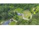 Expansive property featuring lush greenery, a sparkling pool, guest homes, and a charming residence at 3573 Northern Estates Cir, Rocky Mount, NC 27804