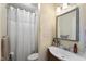 Compact bathroom with a shower/tub combination and a single-sink vanity with a framed mirror at 3573 Northern Estates Cir, Rocky Mount, NC 27804