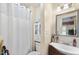 Small bathroom with a shower/tub combination, a single-sink vanity, and a mirrored medicine cabinet at 3573 Northern Estates Cir, Rocky Mount, NC 27804