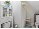 Modern bathroom showing toilet and shower with seat and storage at 3573 Northern Estates Cir, Rocky Mount, NC 27804