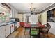 Traditional kitchen with white cabinets, blue countertops, and an adjacent dining area at 3573 Northern Estates Cir, Rocky Mount, NC 27804