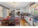 Charming kitchen with stainless steel appliances, wood floors, and an open view to the living area at 3573 Northern Estates Cir, Rocky Mount, NC 27804