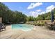 Backyard with a swimming pool, outdoor seating, lounge chairs, and privacy fencing at 3573 Northern Estates Cir, Rocky Mount, NC 27804