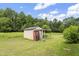 Backyard shed with a vending machine, providing extra storage and convenience on the property at 3573 Northern Estates Cir, Rocky Mount, NC 27804