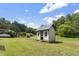 Exterior view of a small shed with a weathered door, offering extra storage space at 3573 Northern Estates Cir, Rocky Mount, NC 27804