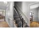Carpeted staircase with dark wood banister, leading to the upper level of the home at 3573 Northern Estates Cir, Rocky Mount, NC 27804