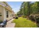 Lovely backyard featuring a well-maintained lawn, a patio, and a deck for outdoor enjoyment at 3806 Stoneybrook Dr, Durham, NC 27705