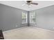 A standard bedroom with two windows and neutral color walls at 3806 Stoneybrook Dr, Durham, NC 27705