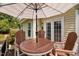 Deck area with outdoor seating, creating a cozy spot for outdoor entertaining at 3806 Stoneybrook Dr, Durham, NC 27705