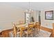Traditional dining room features a wooden table with six chairs and a stylish chandelier at 3806 Stoneybrook Dr, Durham, NC 27705