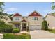Inviting two-story home featuring a charming front porch and a convenient two-car garage at 3806 Stoneybrook Dr, Durham, NC 27705