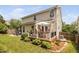 Spacious backyard showcasing a deck, patio, and lush greenery for ultimate outdoor living at 3806 Stoneybrook Dr, Durham, NC 27705