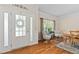 View of the home's entry area and dining room with wood floors and stylish decor at 3806 Stoneybrook Dr, Durham, NC 27705