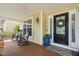 Relaxing front porch features rocking chairs, stylish cushions, and an inviting entryway at 3806 Stoneybrook Dr, Durham, NC 27705
