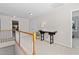 The upstairs hallway features a decorative table, and connects the bedrooms and living areas at 3806 Stoneybrook Dr, Durham, NC 27705