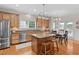 Spacious kitchen with stainless steel appliances, central island, and adjoining dining area at 3806 Stoneybrook Dr, Durham, NC 27705