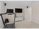 A living room featuring a treadmill, a television and speakers, and a small cabinet at 3806 Stoneybrook Dr, Durham, NC 27705