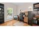 A home office features a built-in desk, ample storage, and a window offering natural light at 3806 Stoneybrook Dr, Durham, NC 27705