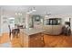 Open-concept kitchen flowing into dining and living area with hardwood floors and contemporary decor at 3806 Stoneybrook Dr, Durham, NC 27705