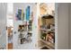 A well-organized pantry boasts shelving on the door and interior, providing ample storage for groceries and household items at 3806 Stoneybrook Dr, Durham, NC 27705