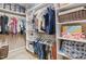 Organized walk-in closet with white shelving and ample storage space for clothes and accessories at 3806 Stoneybrook Dr, Durham, NC 27705