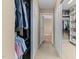 Well-organized walk-in closet with shelving and hanging racks on both sides at 3806 Stoneybrook Dr, Durham, NC 27705