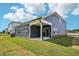 Backyard with covered patio and gray siding at 3813 Rosebush Dr, Zebulon, NC 27597