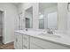 Bathroom featuring double sinks, white cabinets and chrome hardware at 3813 Rosebush Dr, Zebulon, NC 27597