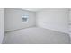 Light-filled carpeted bedroom featuring bright window and fresh decor at 3813 Rosebush Dr, Zebulon, NC 27597