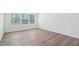 Bright bedroom featuring wood flooring, neutral paint, and natural light at 3813 Rosebush Dr, Zebulon, NC 27597