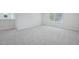 Bright, airy bedroom with two windows and neutral carpeting throughout at 3813 Rosebush Dr, Zebulon, NC 27597