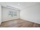 Bedroom with a trey ceiling, wood flooring, and neutral wall paint at 3813 Rosebush Dr, Zebulon, NC 27597