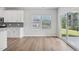 Kitchen with stainless steel appliances and access to the outdoor patio through sliding glass doors at 3813 Rosebush Dr, Zebulon, NC 27597