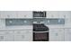 Modern kitchen features stainless steel appliances and white cabinets at 3813 Rosebush Dr, Zebulon, NC 27597