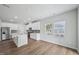 A bright, open-concept kitchen featuring stainless appliances and a spacious kitchen island at 3813 Rosebush Dr, Zebulon, NC 27597