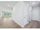 Spacious living room with wood flooring and recessed lighting throughout at 3813 Rosebush Dr, Zebulon, NC 27597