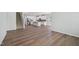 Open-concept living space featuring wood floors and a view of the kitchen at 3813 Rosebush Dr, Zebulon, NC 27597