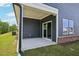 Covered patio with sliding glass door and blue siding at 3813 Rosebush Dr, Zebulon, NC 27597
